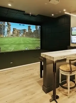 High quality golf simulator setup with custom enclosure and impact screen